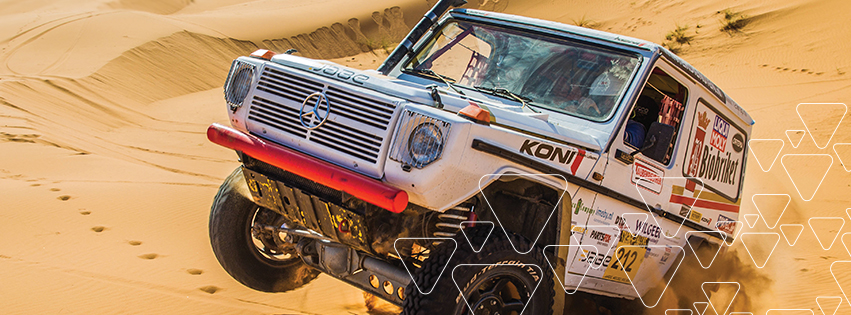 Koni shocks on Mercedes Jeep leaping a desert sandhill