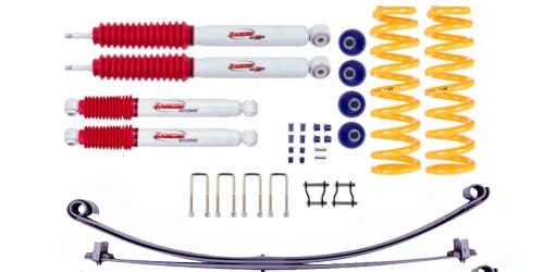 Rancho RS5000X and RS9000XL shock absorbers side by side, showing fixed valve and adjustable knob designs for 4WD suspension comparison.